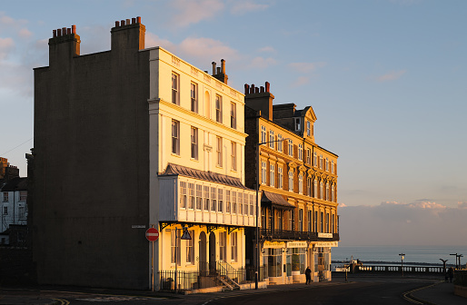 Ramsgate, UK - Dec 12 2020 Impressive Vicotrian architecure buildings illuminated by the sunset on the seafront in Ramsgate