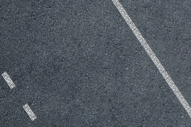 istock Asphalt road texture with marking lines 1290371191