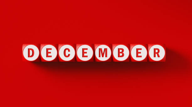 istock December Written Woodblocks Sitting on Red Background 1290372405
