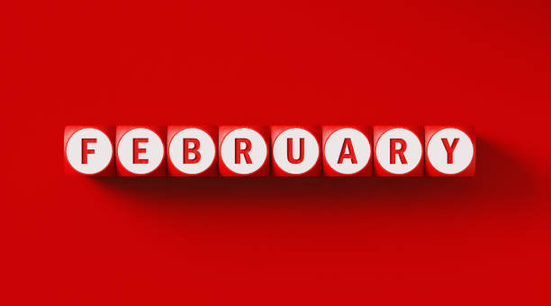 istock February Written Woodblocks Sitting on Red Background 1290372709