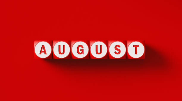istock August Written Woodblocks Sitting on Red Background 1290372813