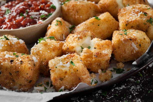 fried halloumi cheese nuggets with marinara dipping sauce - mozzarella stick appetizer fried imagens e fotografias de stock