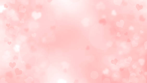istock Soft blurred pink and white background with hearts and circles. Valentines day bokeh background 1290378615