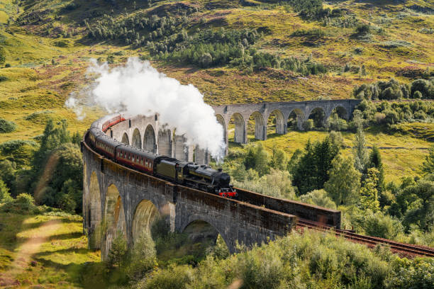 Steam Train on Glenfinnan Viaduct in Scotland in August 2020 stock photo