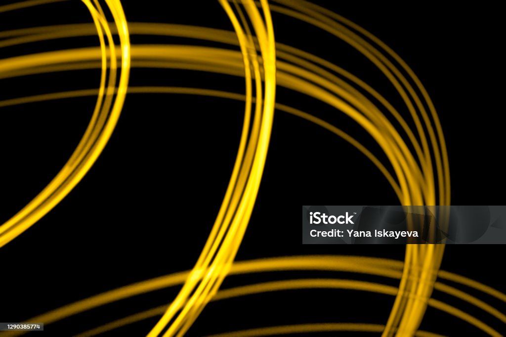 Abstract Illuminating Yellow Lights Illuminating Christmal lights in the dark. Announced color of the year 2021. Isolated background for text copy Amber Light Stock Photo