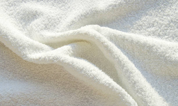 istock White Terry bath towel, texture with pleats, background 1290392402