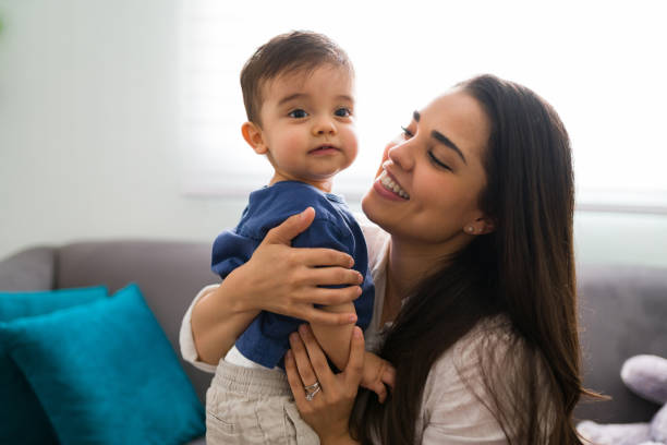 istock Loving mother with cute son at home 1290398147