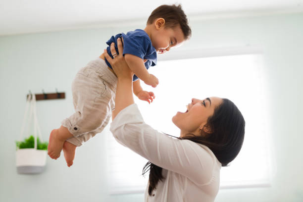 istock Playing mother having great time with son at home 1290398225