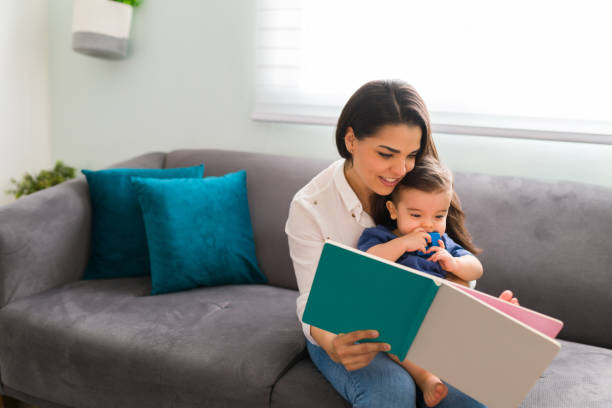 istock Mother reading a picture book for son 1290398460