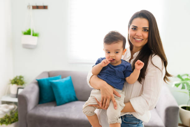 istock Mother spending time with little son at home 1290398464
