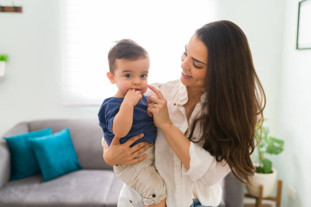 istock Pretty mom with cute baby 1290398470