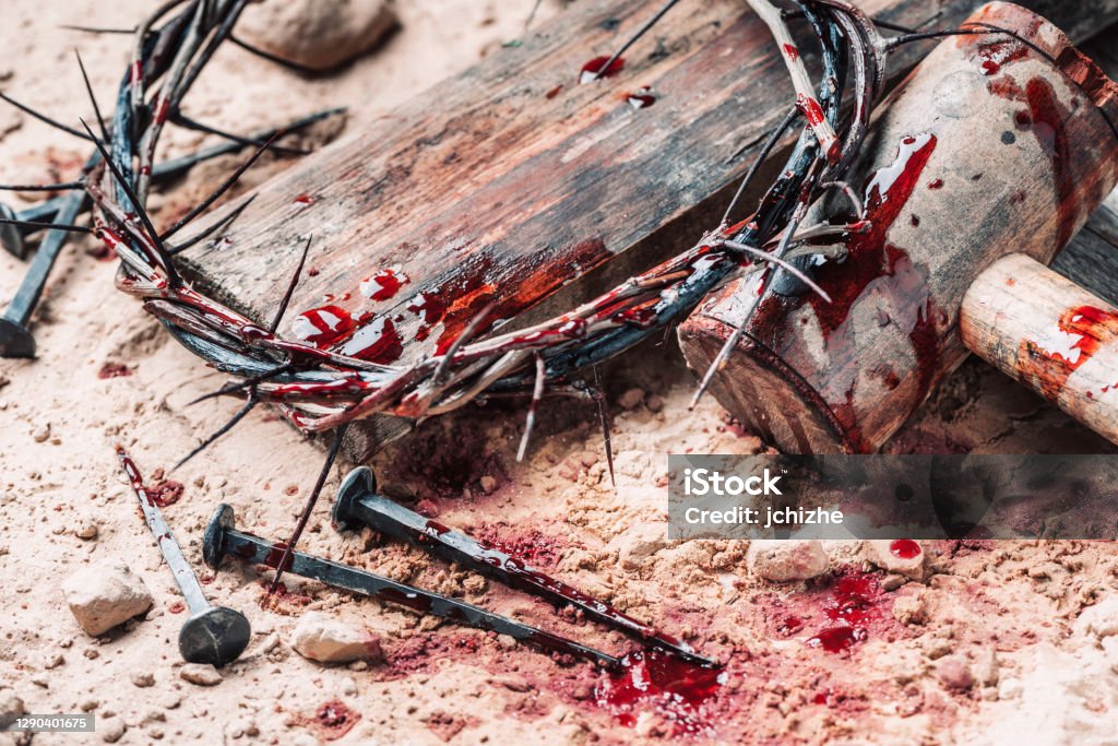 Good Friday, Passion of Jesus Christ. Crown of thorns, hammer, bloody nails on ground. Christian Easter holiday. Top view, copy space. Crucifixion, resurrection of Jesus Christ. Gospel, salvation Good Friday, Passion of Jesus Christ. Crown of thorns, hammer, bloody nails on ground. Christian Easter holiday. Top view, copy space. Crucifixion, resurrection of Jesus Christ. Gospel, salvation. Jesus Christ Stock Photo