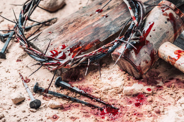Good Friday, Passion of Jesus Christ. Crown of thorns, hammer, bloody nails on ground. Christian Easter holiday. Top view, copy space. Crucifixion, resurrection of Jesus Christ. Gospel, salvation stock photo
