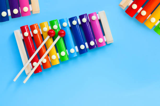 istock Colorful xylophone on blue background. 1290416226