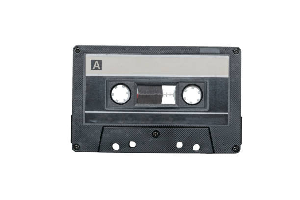 istock Black cassette with magnetic tape isolated on a white background. 1290421043