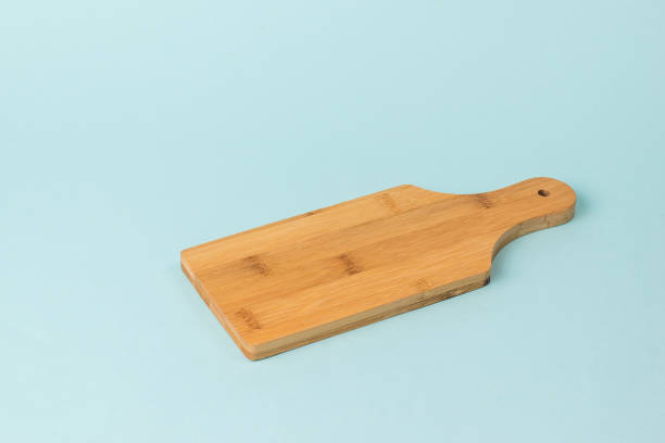 istock Classic wooden cutting Board on a blue background. 1290421140