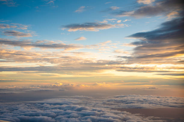 istock Perfect sunset from above of cloud with beautiful clody sky background from plane 1290428513