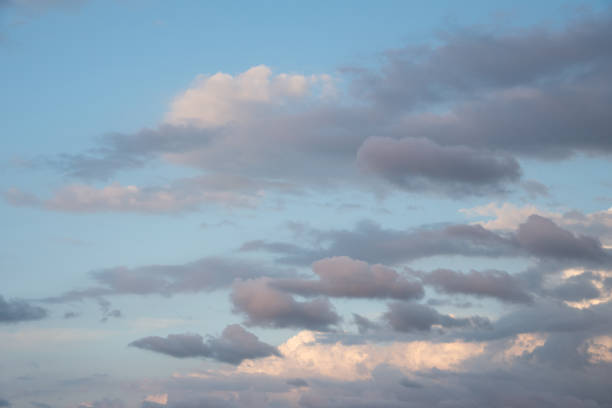 istock Beautiful sky background. Light blue sky with soft white and gray clouds 1290430156