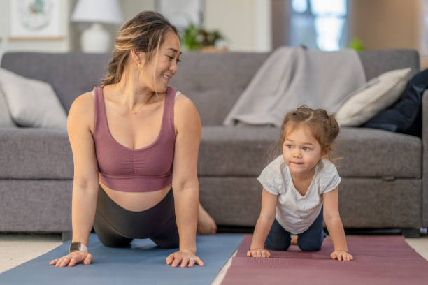 istock Mommy Daughter Yoga 1290435506