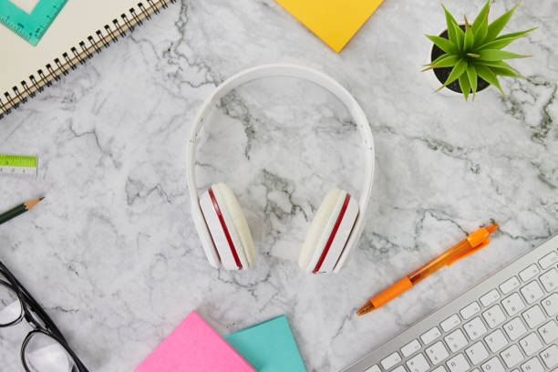 istock Top View or Flat Lay Headphone on Marble Office Desk or Table 1290437122