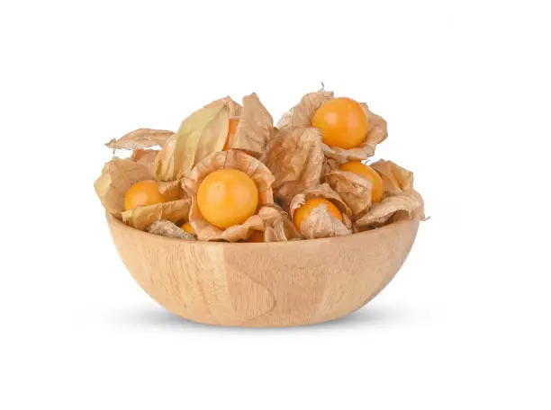 Cape Gooseberry in wood bowl isolated on white background