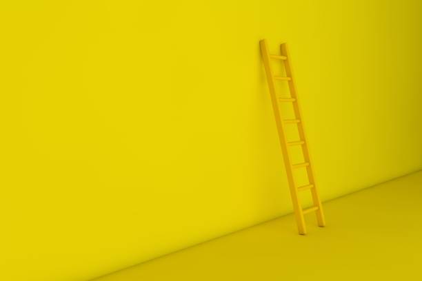 istock Yellow step ladder near the wall 1290440090