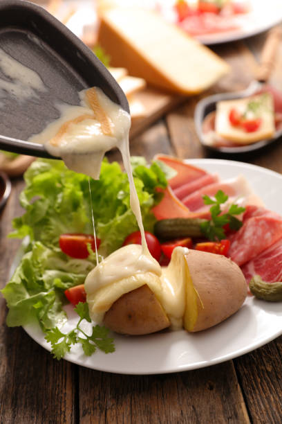 istock raclette cheese with potato and ham 1290444468
