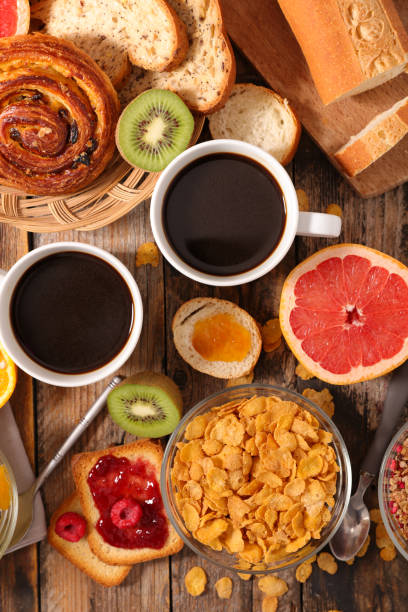 istock full breakfast- coffee cup,  baguette with jam and fruits 1290444773