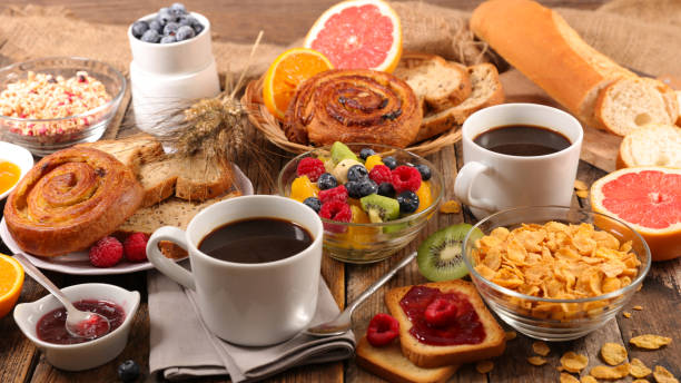 istock full breakfast- coffee cup,  baguette with jam and fruits 1290444774