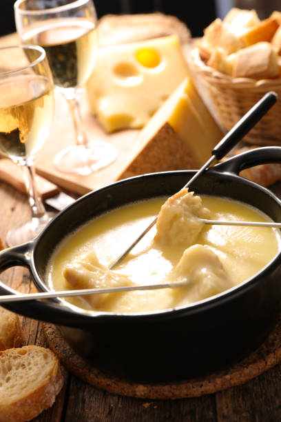 istock cheese fondue with wine and baguette 1290444777