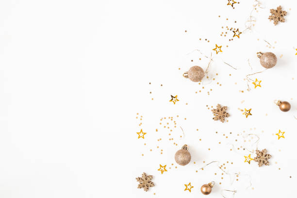 istock Christmas composition. Christmas golden confetti on white background. Flat lay, top view, copy space 1290445804