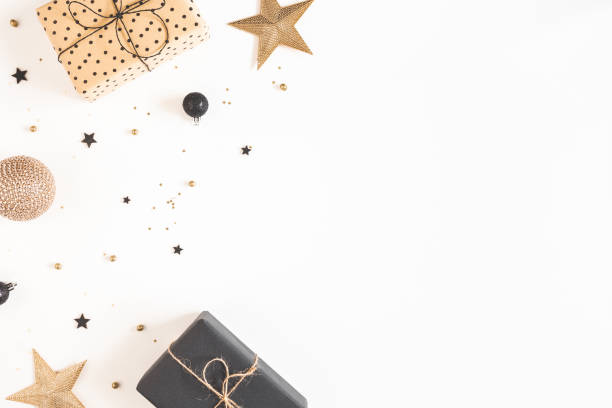 istock Christmas composition. Gift boxes, black and golden decorations on white background. Christmas, winter, new year concept. Flat lay, top view, copy space 1290445810