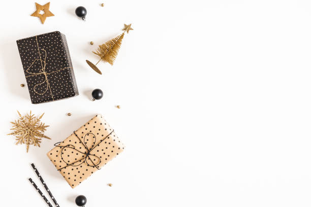 istock Christmas composition. Gift boxes, black and golden decorations on white background. Christmas, winter, new year concept. Flat lay, top view, copy space 1290445836