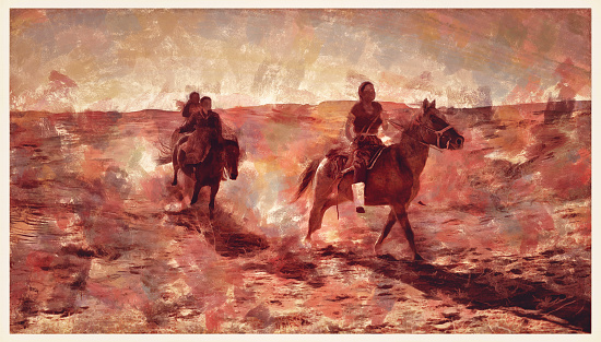 Navajo siblings galloping in Monument Valley Arizona USA