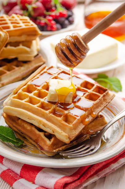 istock Belgian waffles served with butter and honey 1290451352