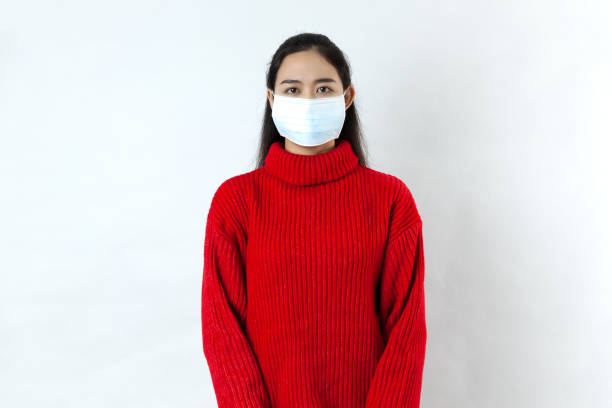 istock A beautiful, calm Asian woman with a protective mask 1290456865