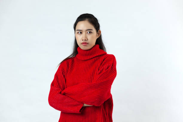 istock pretty Asian woman wearing red sweater 1290458049