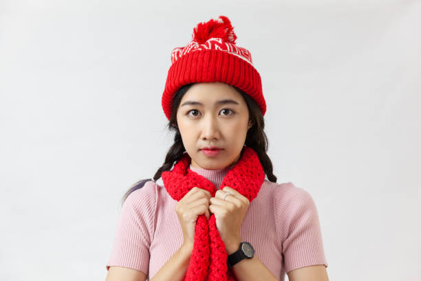 istock Asian woman looking at camera on a white background 1290459509