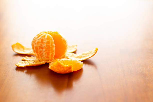 Tea and peeled oranges placed on the kotatsu