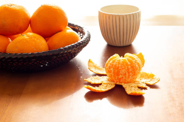 Tea and peeled oranges placed on the kotatsu