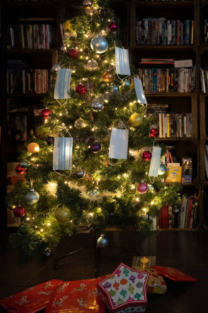 istock Christmas tree decorated with surgical masks 1290464272