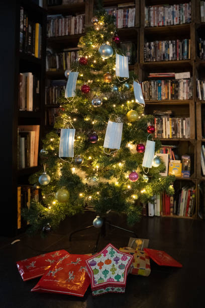 istock Christmas tree decorated with surgical masks 1290464294