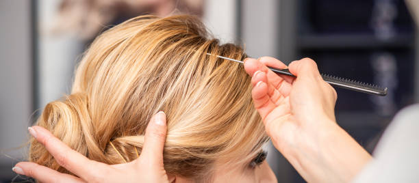 istock Woman receiving her hair done 1290465604