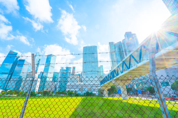 istock Cityscape outside barbed wire fence 1290469267