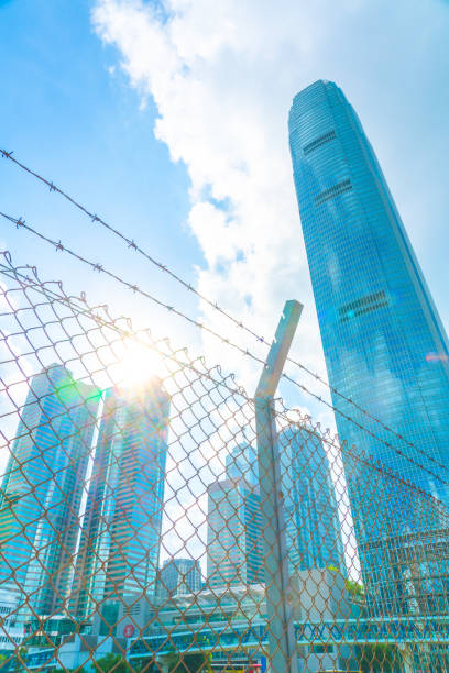 istock Cityscape outside barbed wire fence 1290469276
