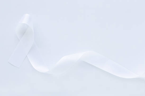 istock White pearl ribbon bow curl on white background with copy space. Lung Cancer Awareness, Mesothelioma and Retinoblastoma cancer symbol. Purity sign for Anti-violence against women, safe motherhood. 1290470711