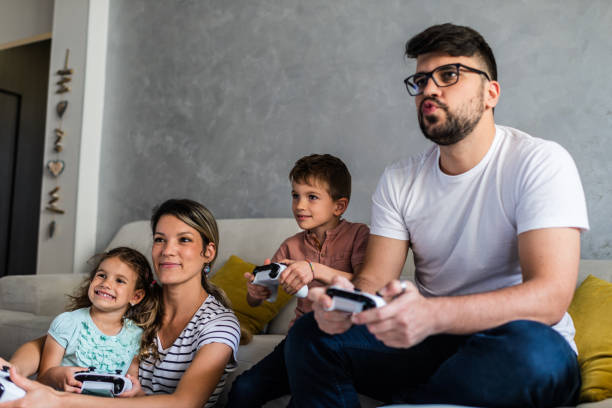 istock Family playing video games 1290471996