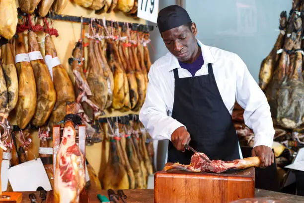 Photo of Seller slicing jamon for sale