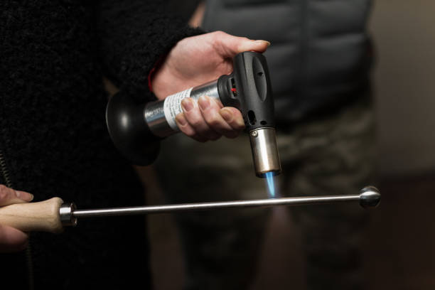 istock Heating up a Beer Spike for putting into dark strong ale to caramelize the sugar 1290472546