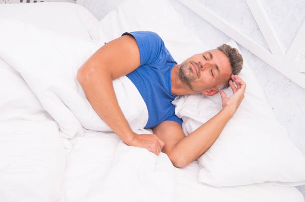 istock Sleeping handsome. Bearded man sleeping face relaxing on pillow. Handsome and sleepy. Sexy man sleeping in bed. Guy lying in bed try to relax and fall sleep. Enjoying beautiful morning 1290472666
